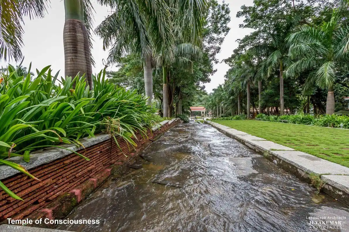 Natural water stream retained and integrated into the landscape master plan of the Temple of Consciousness campus.