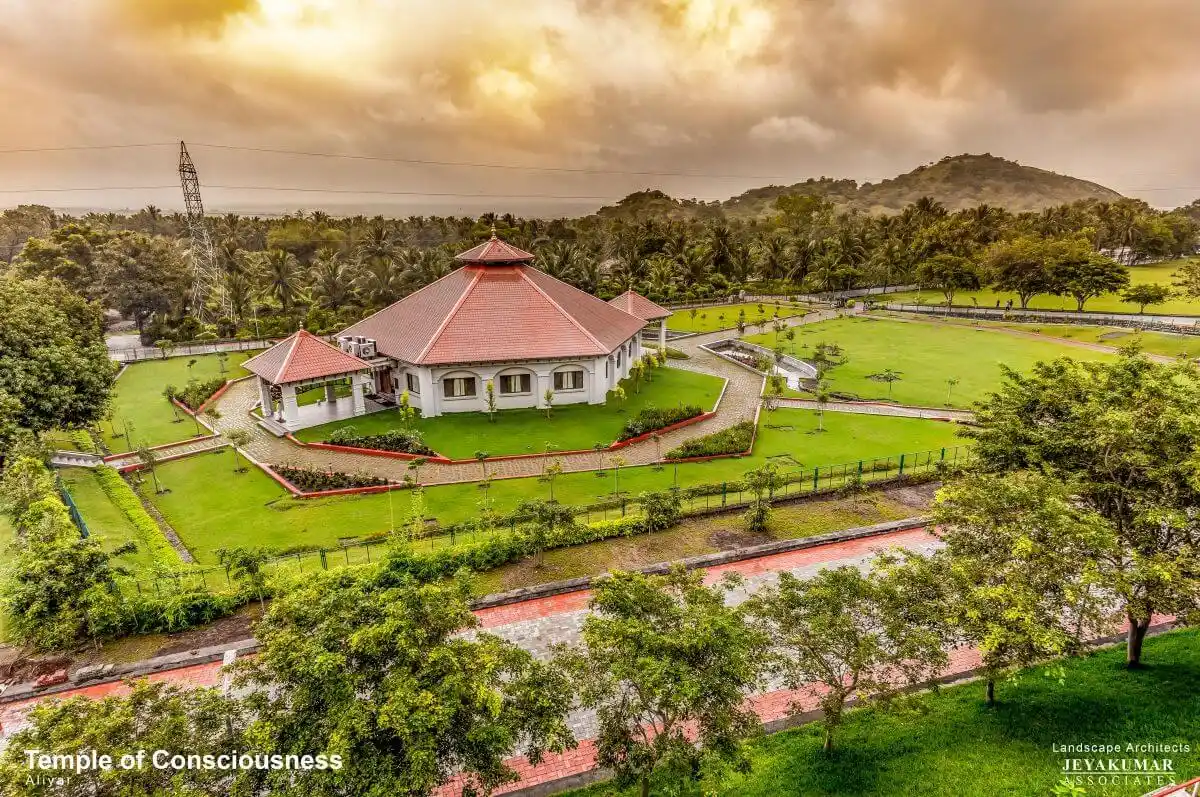 Aerial view of the Temple of Consciousness campus and its landscape setting near the Aliyar reservoir.